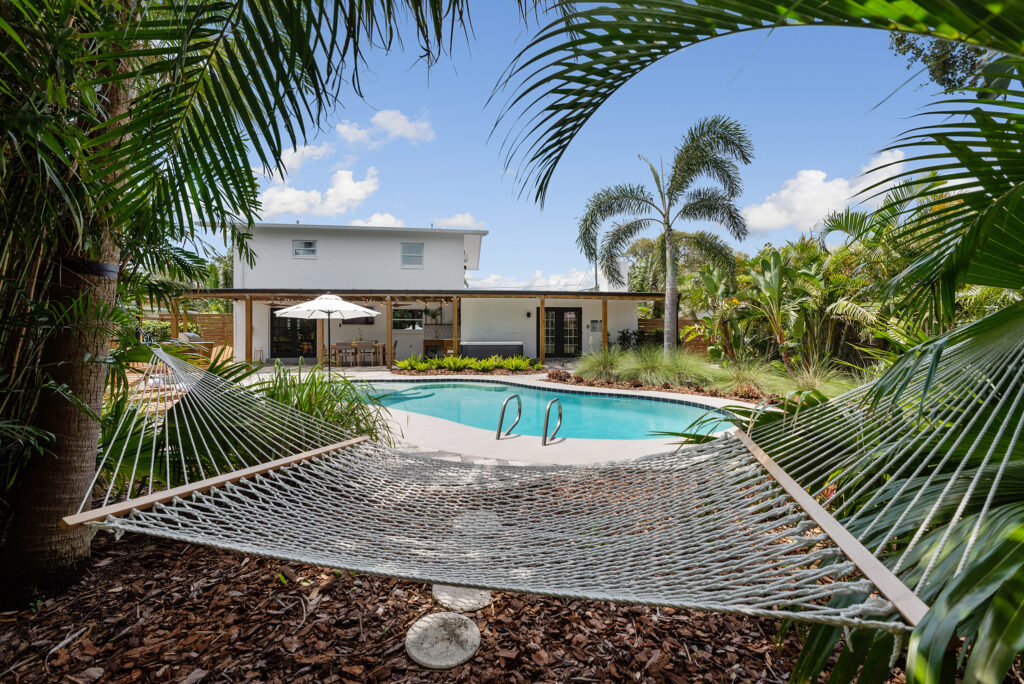 Coastal Scandinavian Retreat with modern pool, hot tub, and covered dining