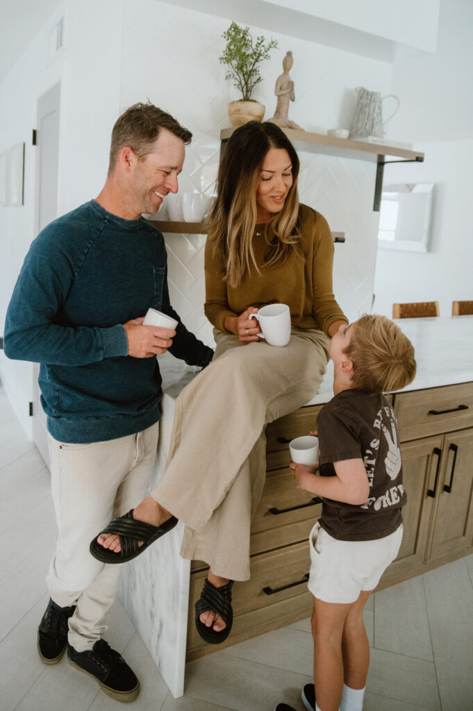 Family sharing a cozy moment in the kitchen of a boutique vacation home in Cocoa Beach.