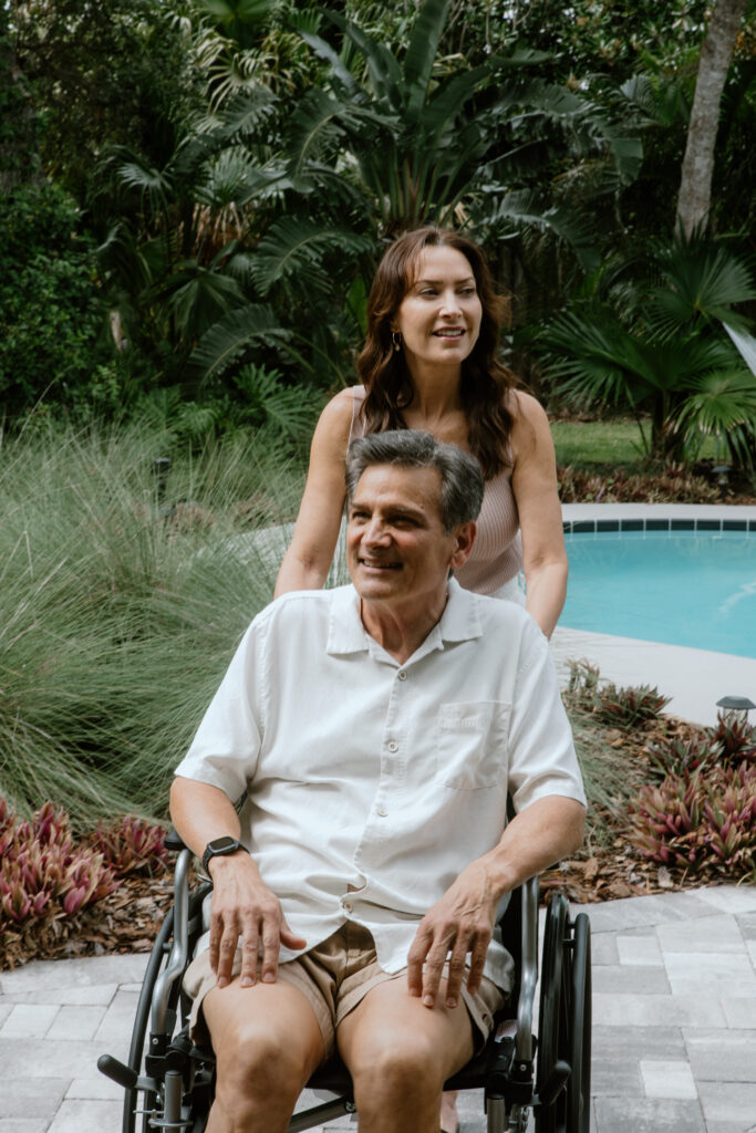 Couple enjoying a relaxed moment by a private pool, surrounded by lush greenery, with soft natural light and a serene outdoor setting