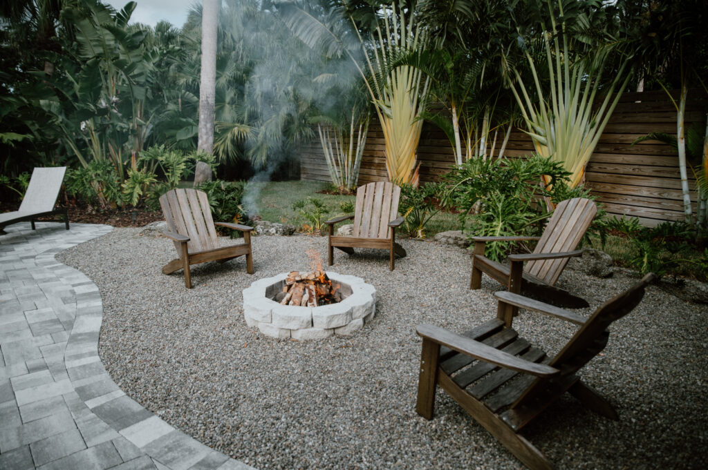 Cozy outdoor firepit surrounded by Adirondack chairs at a boutique Cocoa Beach rental.