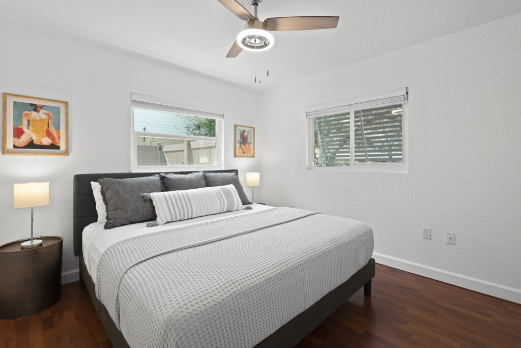 Bright modern bedroom in a boutique vacation home in Cocoa Beach with clean coastal decor and soft neutral tones.